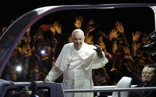 PHILADELPHIA, PA - SEPTEMBER 26:  Pope Francis waves as he rides in the Popemobile in the Papal Parade during the Festival of Families on September 26, 2015 in Philadelphia, Pennsylvania. Pope Francis wraps up his trip to the United States with two days in Philadelphia, attending the Festival of Families and meeting with prisoners at the Curran-Fromhold Correctional Facility. (Photo by Matt Rourke-Pool/Getty Images)